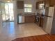Functional kitchen with stainless steel appliances, ample cabinet space, and a view to the entryway at 2625 State Road 590 # 2832, Clearwater, FL 33759