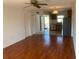 Inviting living room showcasing hardwood floors, bright lighting and open flow to the kitchen at 2625 State Road 590 # 2832, Clearwater, FL 33759