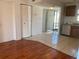 Spacious living room with an open floor plan that flows to kitchen, tile floors, and a closet at 2625 State Road 590 # 2832, Clearwater, FL 33759