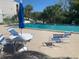 Relaxing pool area with comfortable seating, perfect for enjoying sunny days and leisure at 2625 State Road 590 # 2832, Clearwater, FL 33759