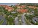 Aerial view of residential buildings, waterfront access, pool, and well-maintained landscaping at 2739 Via Capri # 1011, Clearwater, FL 33764