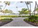 Scenic community pathway featuring grill, waterfront, and bay views at 2739 Via Capri # 1011, Clearwater, FL 33764