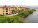 Beautiful waterfront property with lush landscaping, walking path, and stunning bay views at 2739 Via Capri # 1011, Clearwater, FL 33764