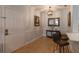 Inviting foyer with tile flooring, a mirror, and decorative lighting at 2739 Via Capri # 1011, Clearwater, FL 33764