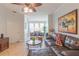 A spacious living room with tile flooring and access to the dining area at 2739 Via Capri # 1011, Clearwater, FL 33764