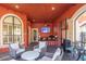 A relaxing outdoor patio with comfortable seating, ceiling fan and outdoor bar area at 2739 Via Capri # 1011, Clearwater, FL 33764