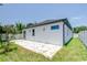 Exterior view showcasing the backyard with a patio and lush green grass at 3004 W Abdella St, Tampa, FL 33607