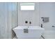 Contemporary bathroom featuring a freestanding soaking tub with modern fixtures at 3004 W Abdella St, Tampa, FL 33607