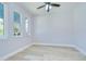 Bright bedroom with natural light, three windows, and light wood floors at 3004 W Abdella St, Tampa, FL 33607