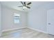 A cozy bedroom with a ceiling fan and natural light from the window at 3004 W Abdella St, Tampa, FL 33607
