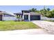 Beautiful home featuring a well-manicured lawn, modern design, and striking curb appeal at 3004 W Abdella St, Tampa, FL 33607