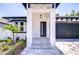 Inviting front entrance with modern architecture, landscaping, and a stylish front door at 3004 W Abdella St, Tampa, FL 33607