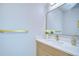 Well-lit half bathroom with modern vanity and elegant gold accents at 3004 W Abdella St, Tampa, FL 33607