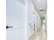 Hallway featuring bright lighting, clean doors, and modern design at 3004 W Abdella St, Tampa, FL 33607