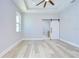 A spacious main bedroom has light wood floors and access to the main bathroom at 3004 W Abdella St, Tampa, FL 33607