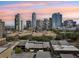 Aerial view showcasing the community's proximity to the city skyline during a vibrant sunset at 301 2Nd N St # 15, St Petersburg, FL 33701