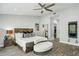 Bright primary bedroom featuring a ceiling fan, with an adjacent walk-in closet at 301 2Nd N St # 15, St Petersburg, FL 33701
