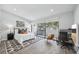 Bright bedroom with balcony access, modern decor, stylish rug, and dedicated office space at 301 2Nd N St # 15, St Petersburg, FL 33701