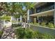 Exterior view of condo units with patios, balconies and lush landscaping at 301 2Nd N St # 15, St Petersburg, FL 33701