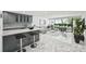 Kitchen with counter seating overlooking the living room and outdoor patio at 301 2Nd N St # 15, St Petersburg, FL 33701
