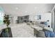 Living area with a modern kitchen, comfortable seating and view to the outdoor patio at 301 2Nd N St # 15, St Petersburg, FL 33701