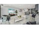 Bright living room featuring tile floors, modern decor, and open layout to the kitchen at 301 2Nd N St # 15, St Petersburg, FL 33701