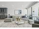 Living room with a comfortable seating area, modern decor, marble floors, and view of the outdoor patio at 301 2Nd N St # 15, St Petersburg, FL 33701