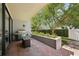 Cozy patio with brick flooring, outdoor grill, and lush greenery for private outdoor space at 301 2Nd N St # 15, St Petersburg, FL 33701