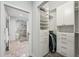 Bright closet with custom built-in shelving and a bathroom view, offering ample storage space at 301 2Nd N St # 15, St Petersburg, FL 33701