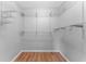 Walk-in closet with wood floors, white walls and wire shelving at 3125 W Fielder St, Tampa, FL 33611