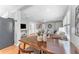 Dining area with hardwood floors, dining table, and open flow to living room at 3125 W Fielder St, Tampa, FL 33611