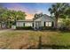Charming single-story home showcasing manicured landscaping and an inviting facade with large windows at 3125 W Fielder St, Tampa, FL 33611