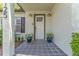 Inviting front porch with potted plants and a stylish front door at 3125 W Fielder St, Tampa, FL 33611