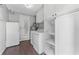 Spacious laundry room with new washer, dryer, storage, and exterior access at 3125 W Fielder St, Tampa, FL 33611