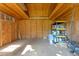 Interior view of the shed, ready for storage with shelving and plywood construction at 3125 W Fielder St, Tampa, FL 33611