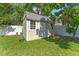 Exterior view of a backyard shed with a metal roof and white trim at 3125 W Fielder St, Tampa, FL 33611