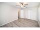 Spacious bedroom with ceiling fan, double closet and ensuite bathroom at 3305 Blythe Ave, Spring Hill, FL 34609