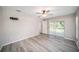 Bedroom featuring a ceiling fan and sliding glass doors to an outdoor patio at 3305 Blythe Ave, Spring Hill, FL 34609