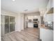 Efficient kitchen area featuring white cabinets, stainless appliances, and natural light at 3305 Blythe Ave, Spring Hill, FL 34609