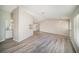 Spacious living room featuring vaulted ceiling, laminate flooring, and an open design at 3305 Blythe Ave, Spring Hill, FL 34609