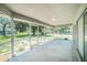 Large screened patio with views of the spacious backyard and surrounding neighborhood at 3305 Blythe Ave, Spring Hill, FL 34609