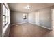 Bright, serene bedroom with tiled floors, a closet and a window, creating a simple and calming space at 4214 Fairfield S Ave, St Petersburg, FL 33711