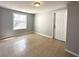 Cozy bedroom featuring tiled flooring and neutral walls, providing a peaceful retreat at 4214 Fairfield S Ave, St Petersburg, FL 33711