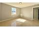 A cozy bedroom is filled with natural light through the window and features tile floors at 4214 Fairfield S Ave, St Petersburg, FL 33711