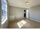 A well-lit bedroom has a window and tan tiled flooring throughout at 4214 Fairfield S Ave, St Petersburg, FL 33711
