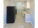 Functional kitchen design with appliances, tile floors and ample counter space at 4214 Fairfield S Ave, St Petersburg, FL 33711