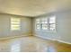 Bright living room featuring large windows and neutral tile flooring, offering a clean, spacious feel at 4214 Fairfield S Ave, St Petersburg, FL 33711