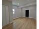 Spacious bedroom featuring wood floors, a closet, and natural light from a window at 4434 Bass St, Tampa, FL 33617