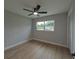 Bedroom featuring a ceiling fan and view outside at 4434 Bass St, Tampa, FL 33617