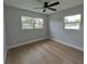 Bedroom featuring a ceiling fan and multiple windows at 4434 Bass St, Tampa, FL 33617
